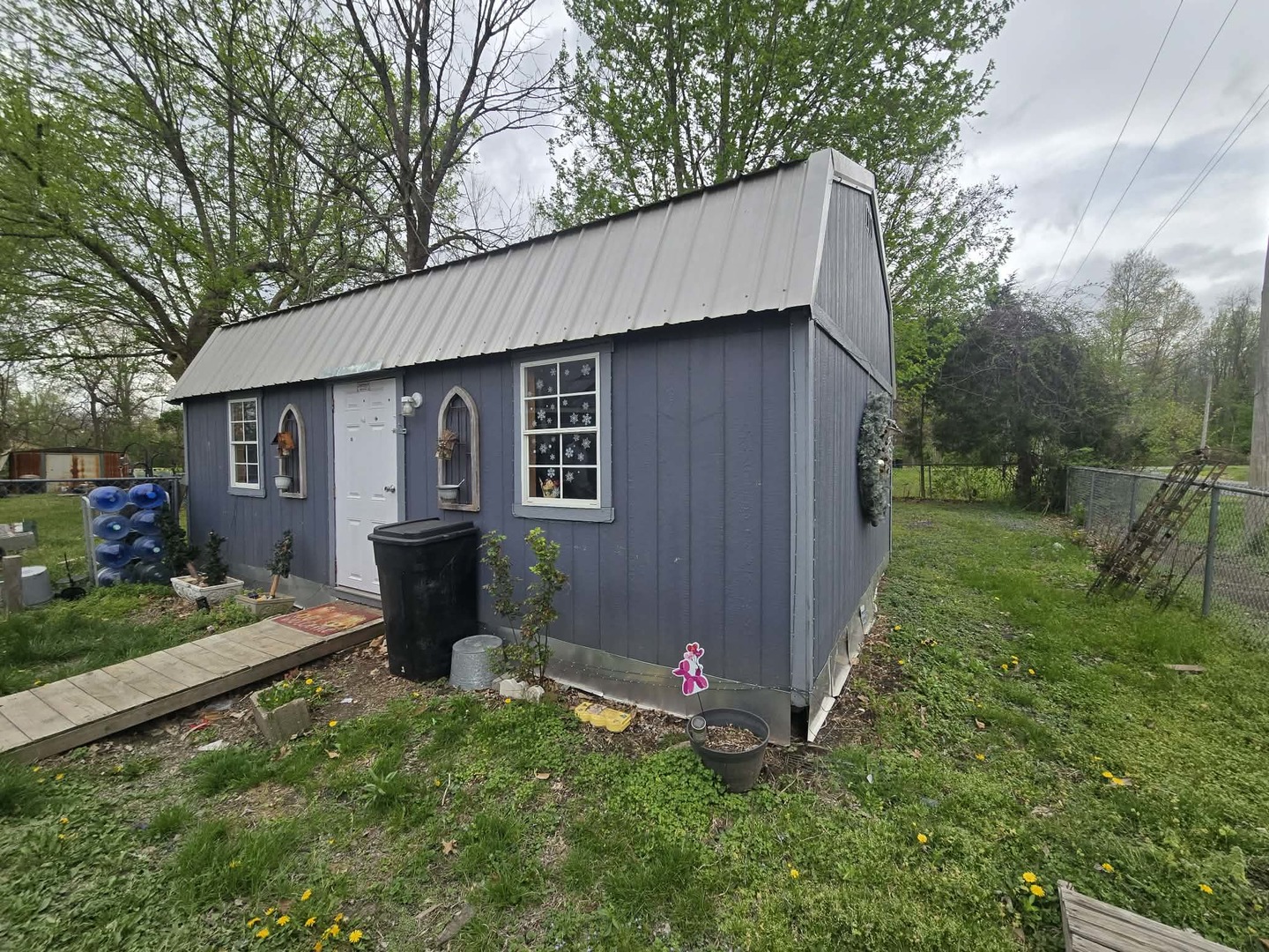208 West Bryan Street Herrin, IL 62948 - Photo 24 of 27 a backyard of a house with table and chairs