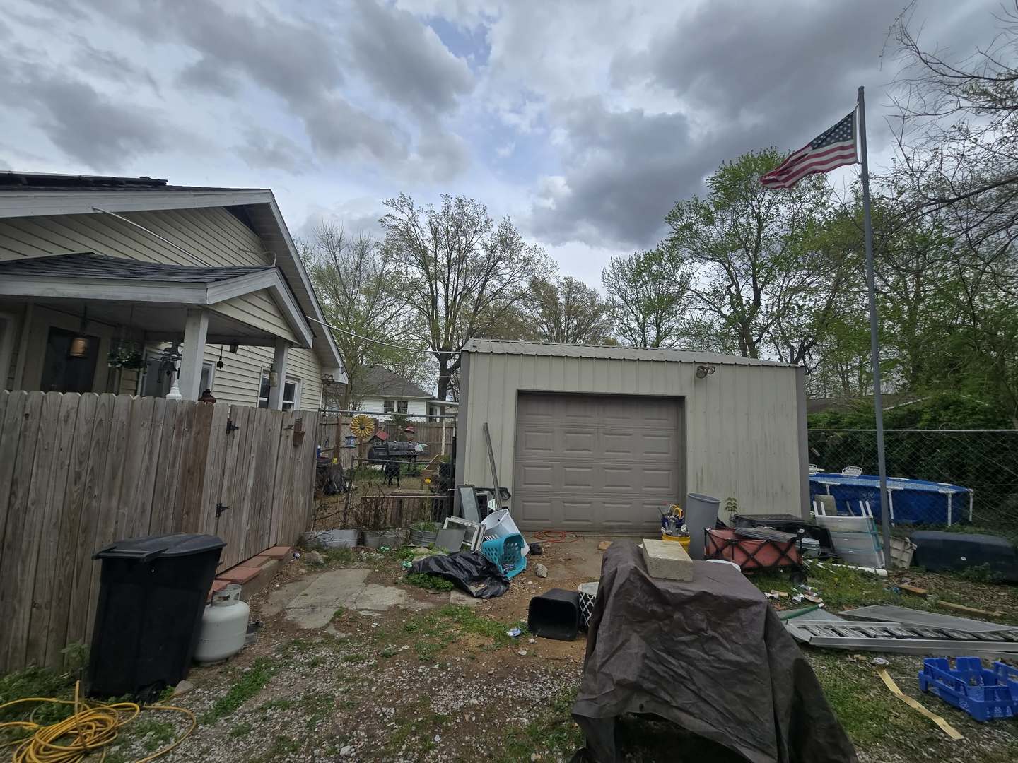 208 West Bryan Street Herrin, IL 62948 - Photo 26 of 27 a backyard of a house with barbeque oven table and chairs