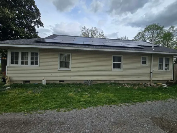 a backyard of a house with lots of green space