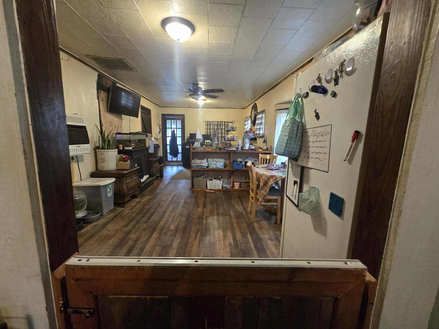 208 West Bryan Street Herrin, IL 62948 - Photo 8 of 27 a view of kitchen with furniture and wooden floor