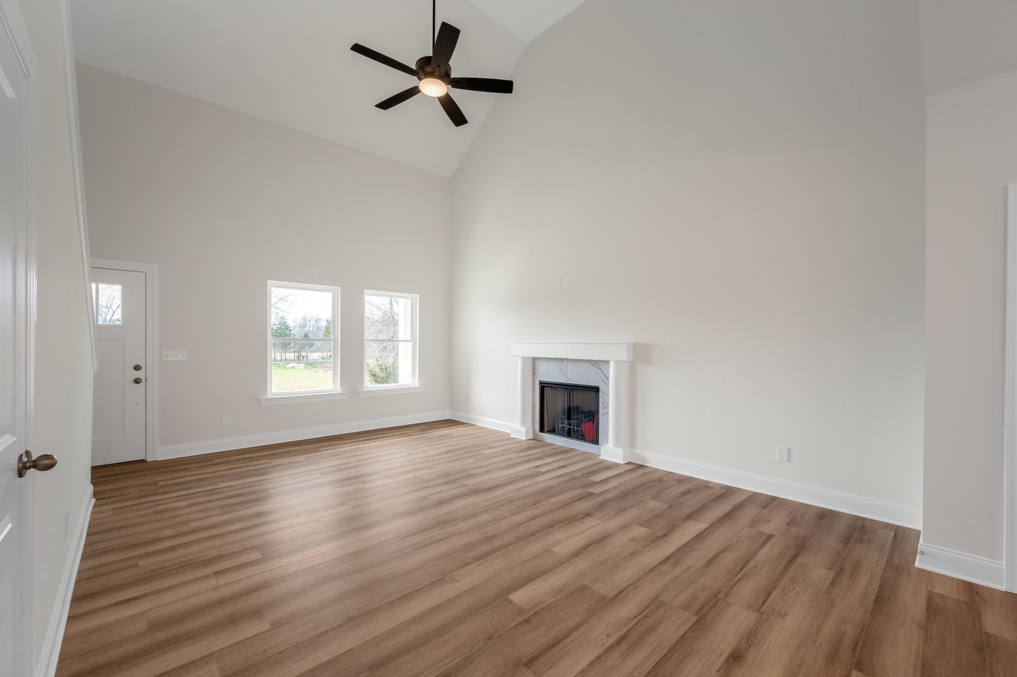 3099 Gwynn Road Lebanon, TN 37090 - Photo 13 of 44 a view of empty room with wooden floor and fan