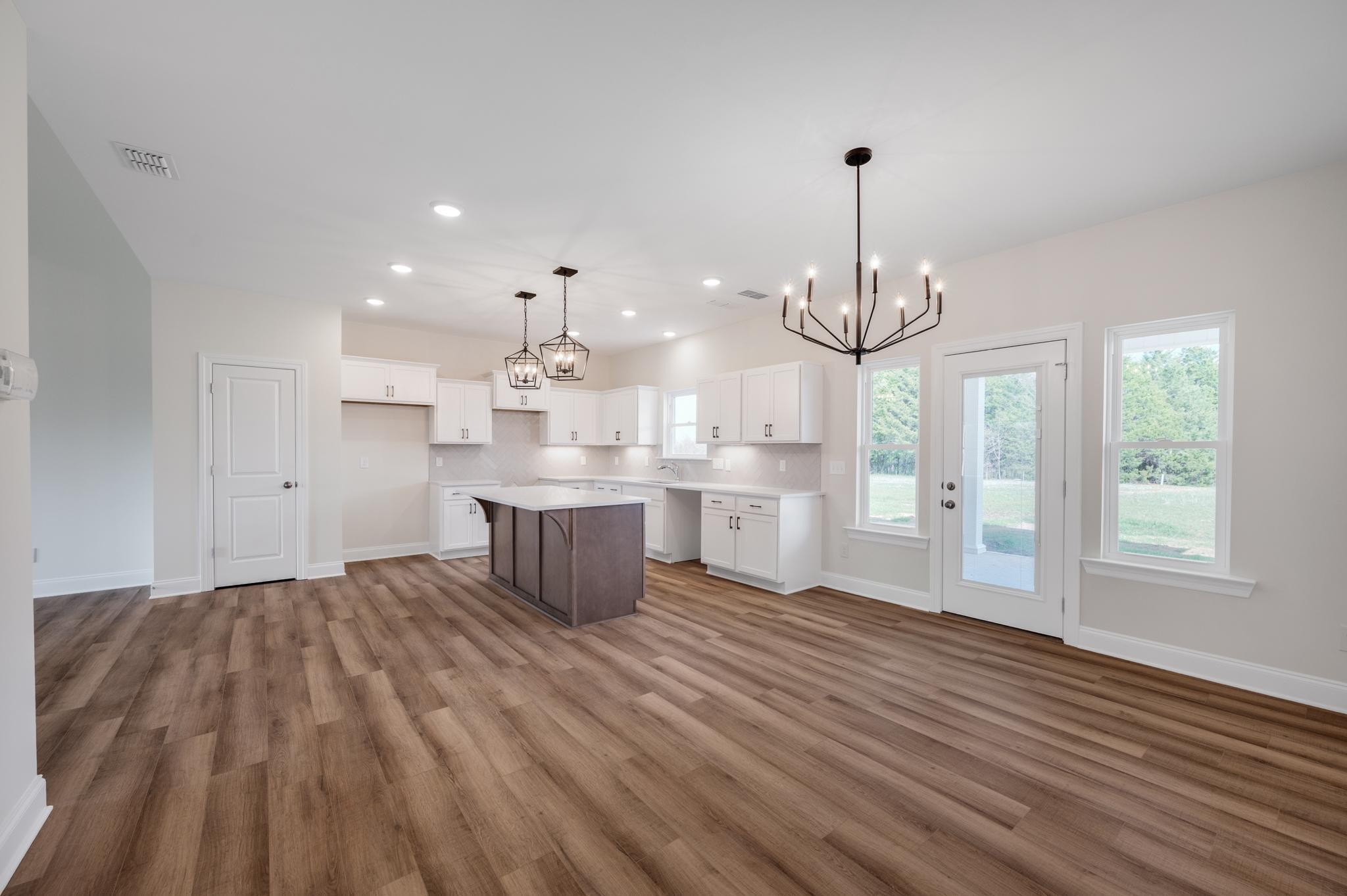 3099 Gwynn Road Lebanon, TN 37090 - Photo 18 of 44 a open kitchen with kitchen island white cabinets and stainless steel appliances