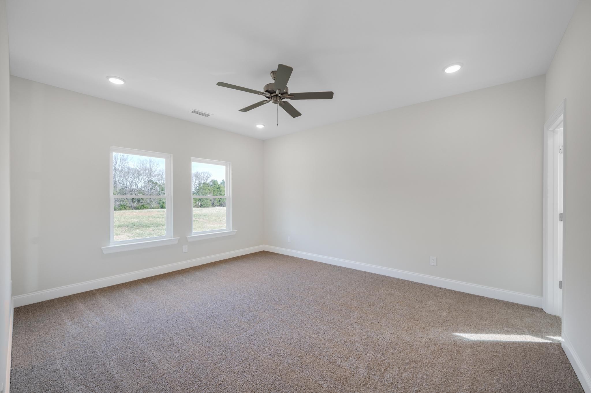 3099 Gwynn Road Lebanon, TN 37090 - Photo 20 of 44 an empty room with a window and a fan