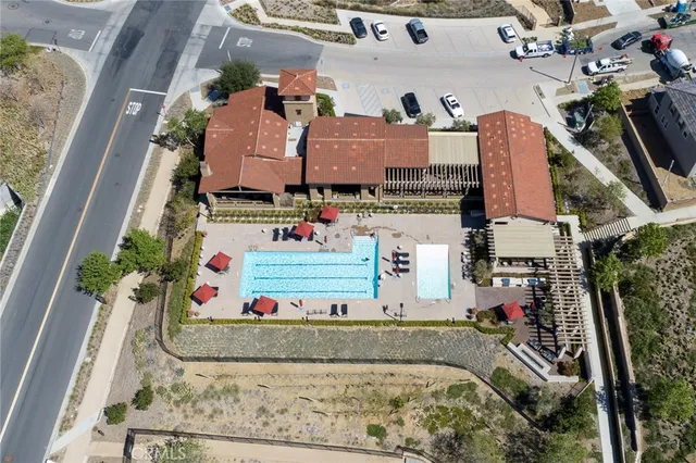 a view of a house with a yard and a fountain