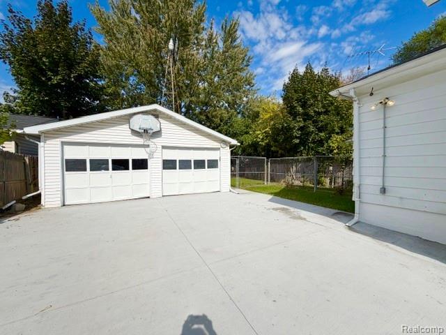 2840 Miller Road Flint, MI 48503 - Photo 3 of 49 Detached two-car garage with white paneled doors and a concrete driveway