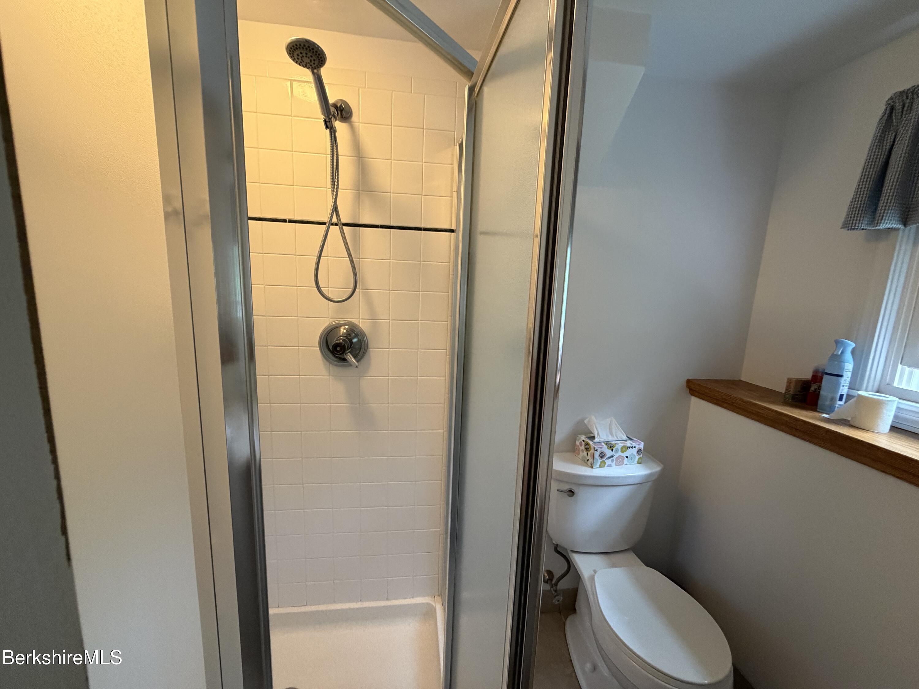20 Sullivan Lane Lenox, MA 01240 - Photo 13 of 23 a white toilet sitting next to a bathroom sink