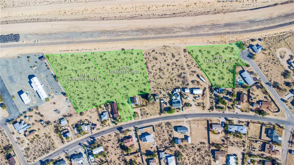 62070 Easterly Place Joshua Tree, CA 92252 - Photo 12 of 12 a view of a wooden bench with potted plants