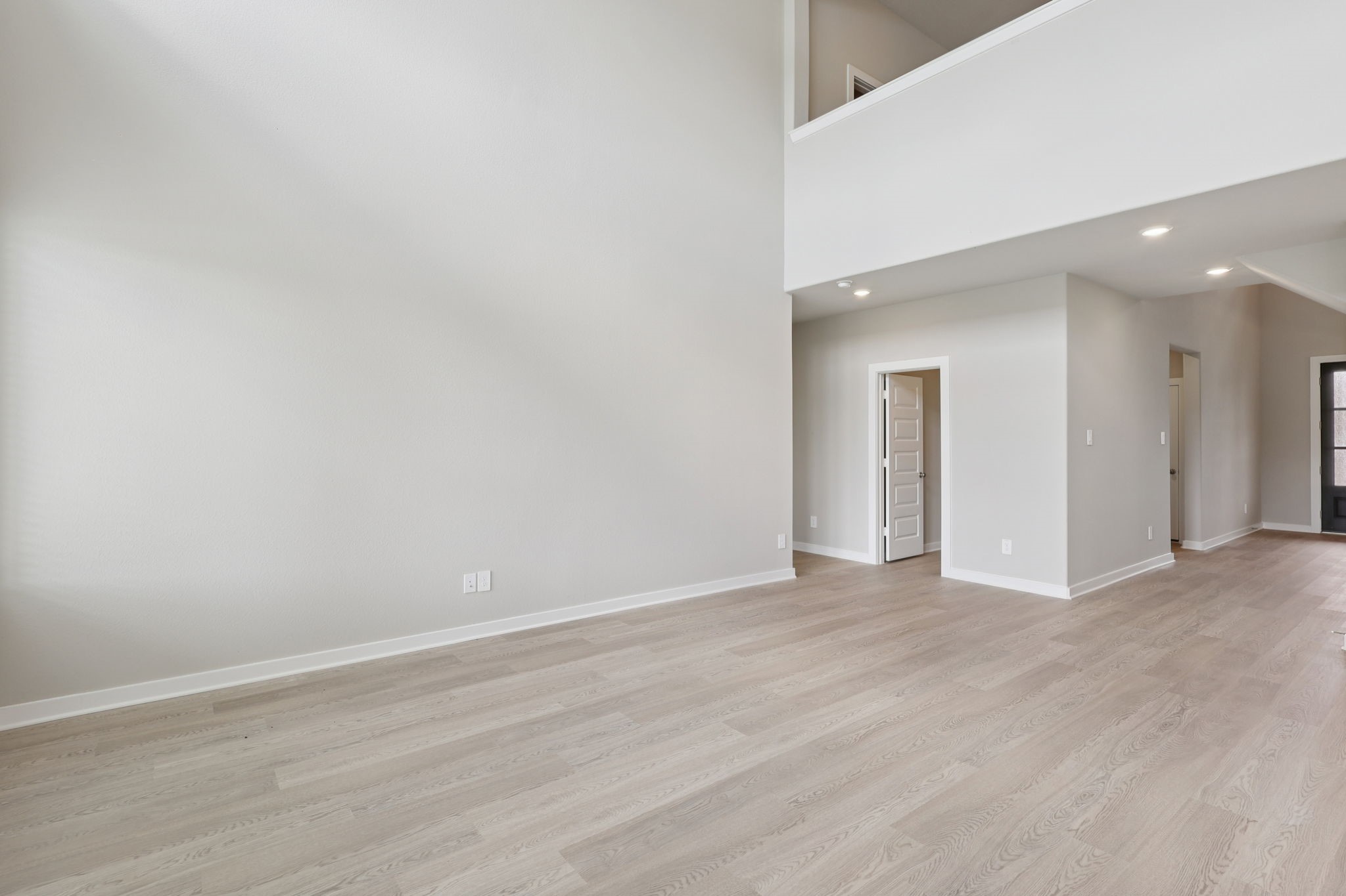 2702 Dark Lantern Drive Rosenberg, TX 77471 - Photo 12 of 39 a view of an empty room with wooden floor
