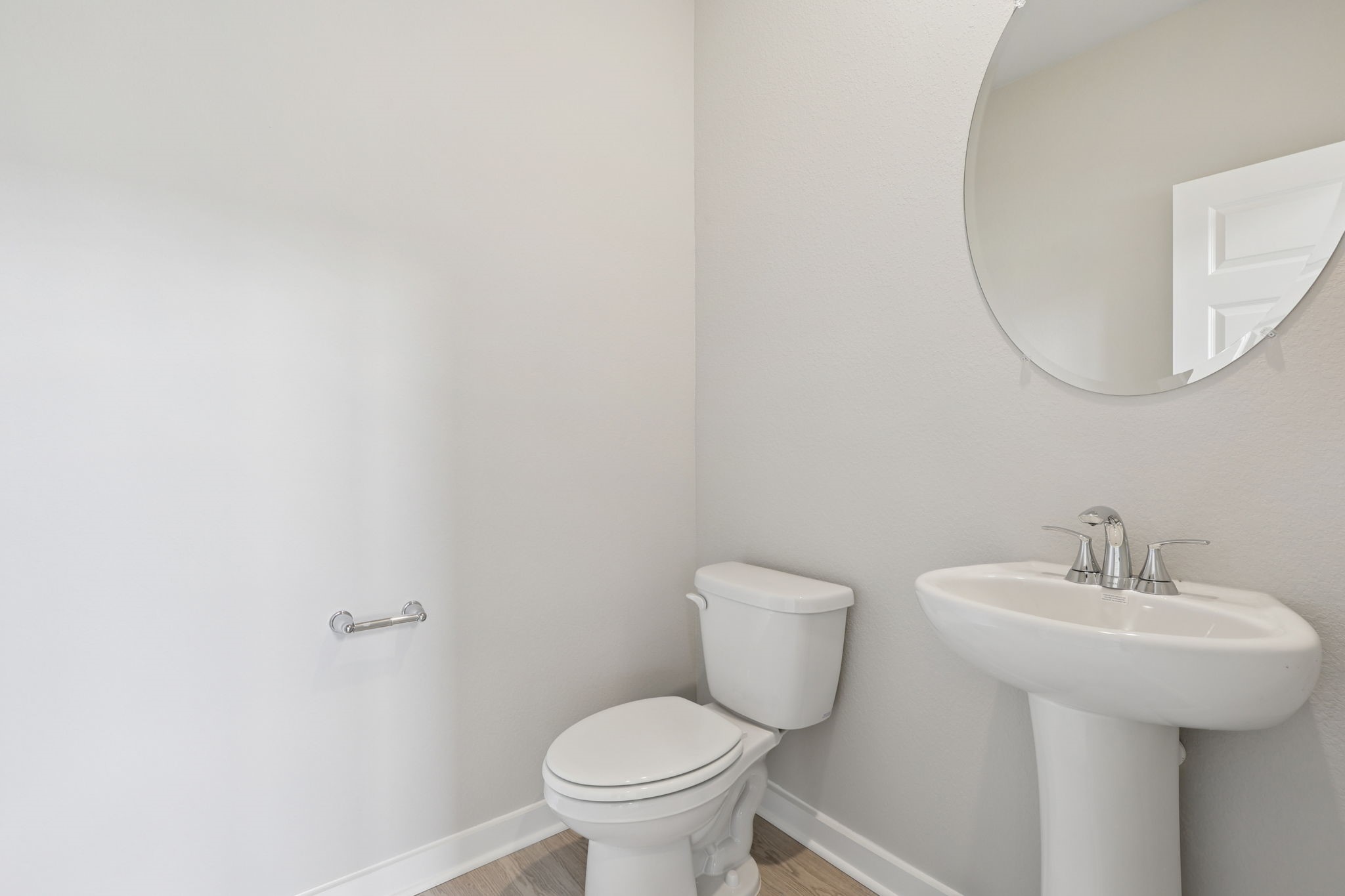 2702 Dark Lantern Drive Rosenberg, TX 77471 - Photo 7 of 39 a bathroom with a toilet sink and mirror