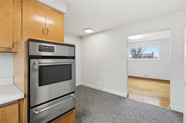 a view of a hallway with washer and dryer