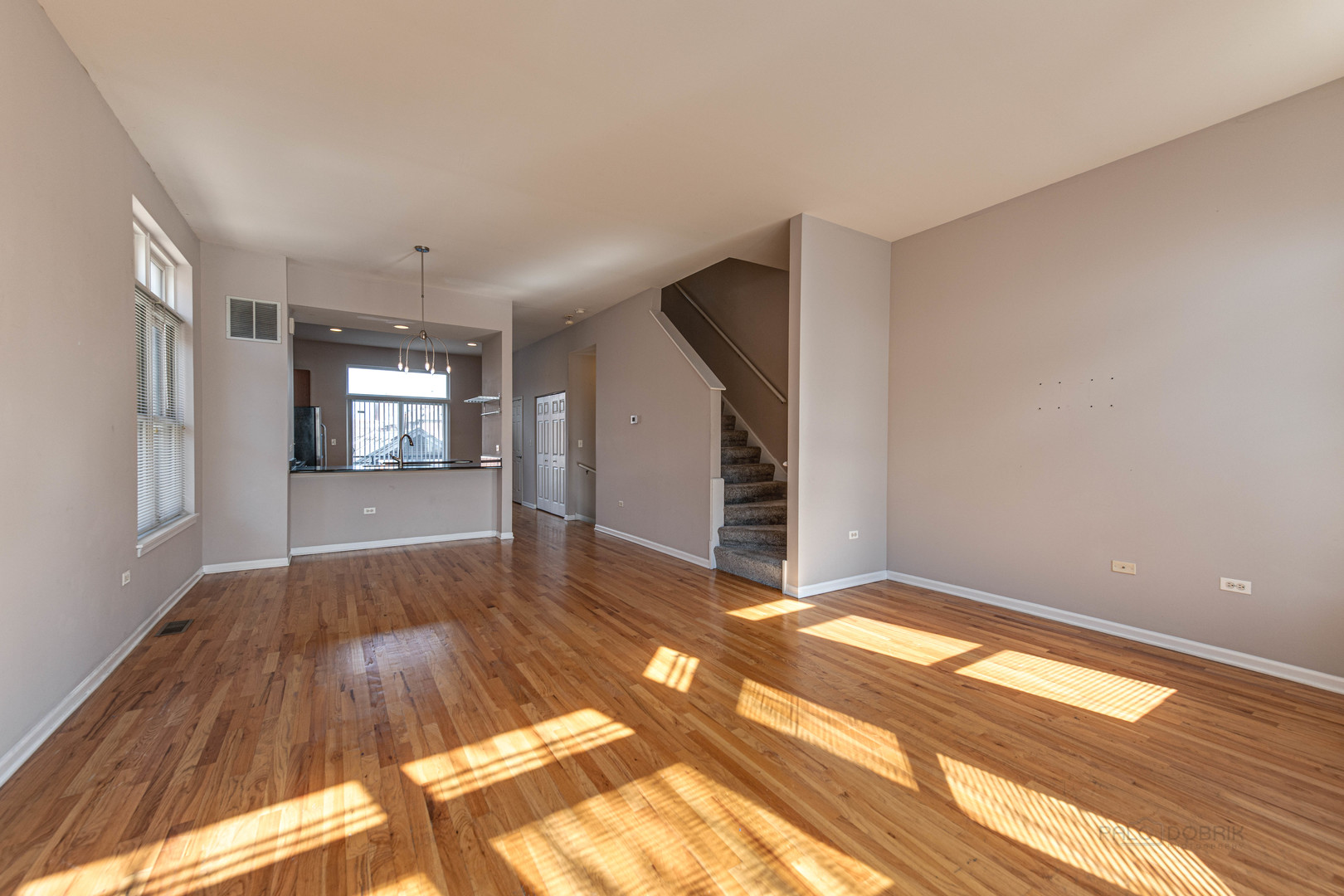 736 West 15th Street Chicago, IL 60607 - Photo 6 of 23 a view of livingroom with window and hardwood floor