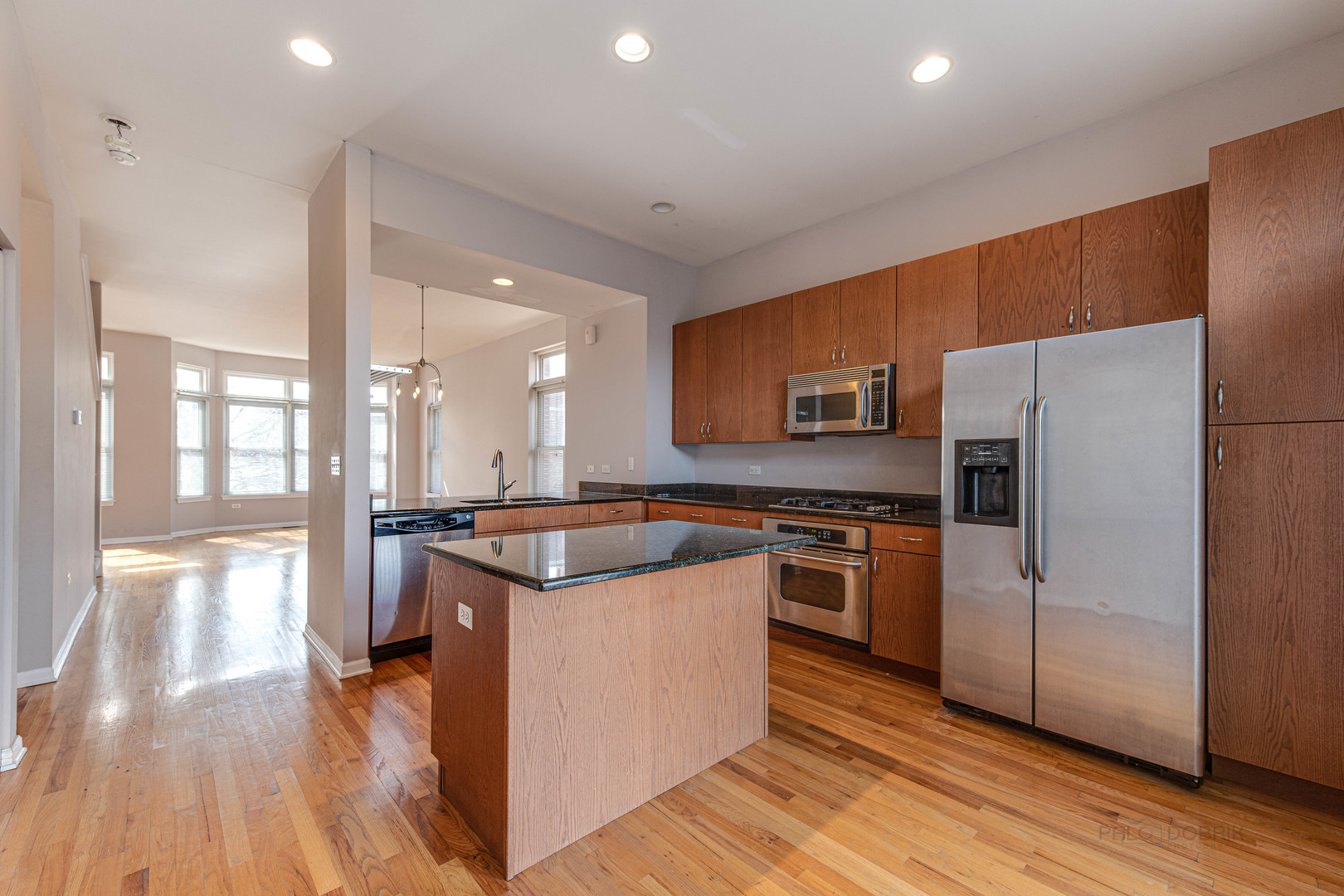 736 West 15th Street Chicago, IL 60607 - Photo 7 of 23 a kitchen with stainless steel appliances granite countertop a stove and a refrigerator