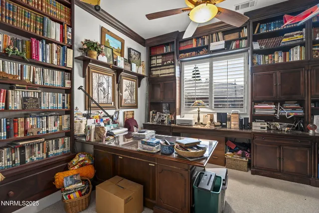 a living room with fireplace furniture and a flat screen tv