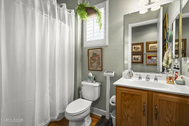 a open kitchen with a table chairs and white cabinets