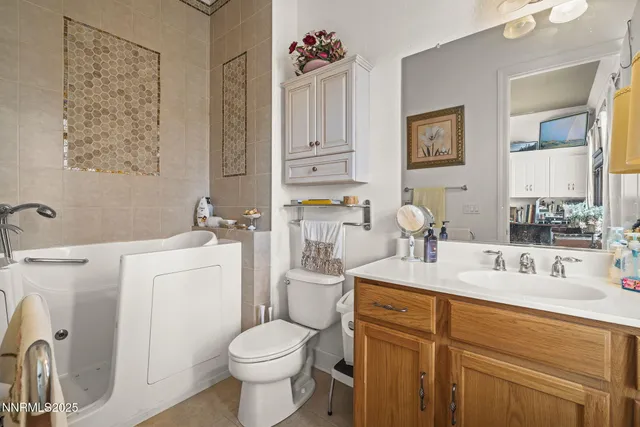 a utility room with sink dryer and washer