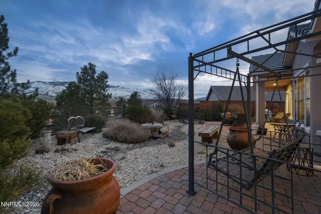 a view of a house with wooden floor and outdoor seating