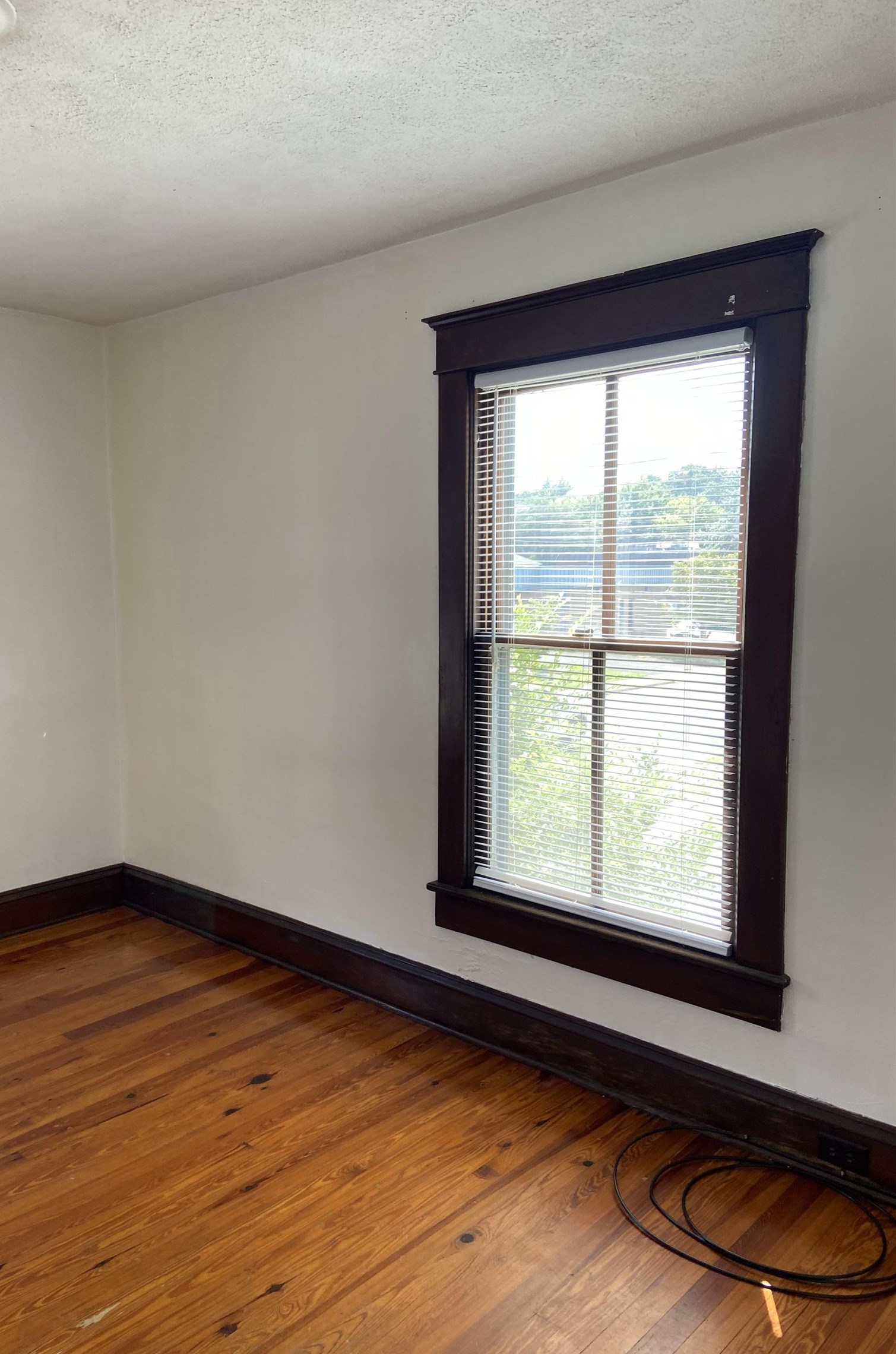 373 South Magnolia Avenue Waynesboro, VA 22980 - Photo 17 of 29 a view of an empty room with wooden floor and a window