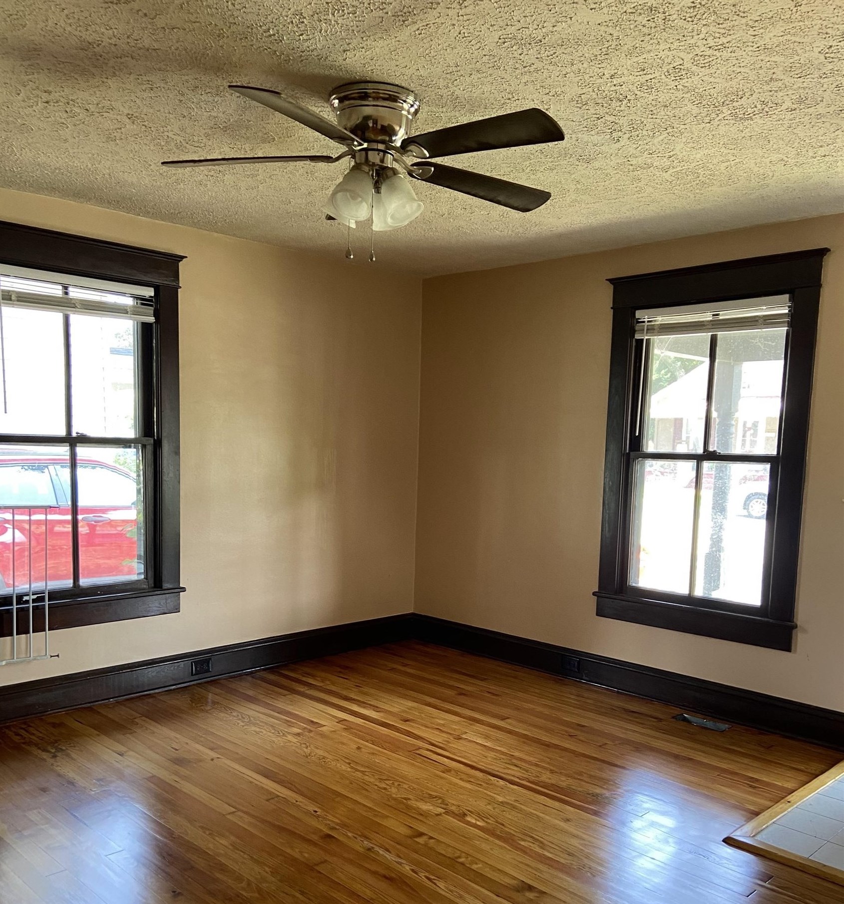 373 South Magnolia Avenue Waynesboro, VA 22980 - Photo 2 of 29 an empty room with wooden floor fan and windows
