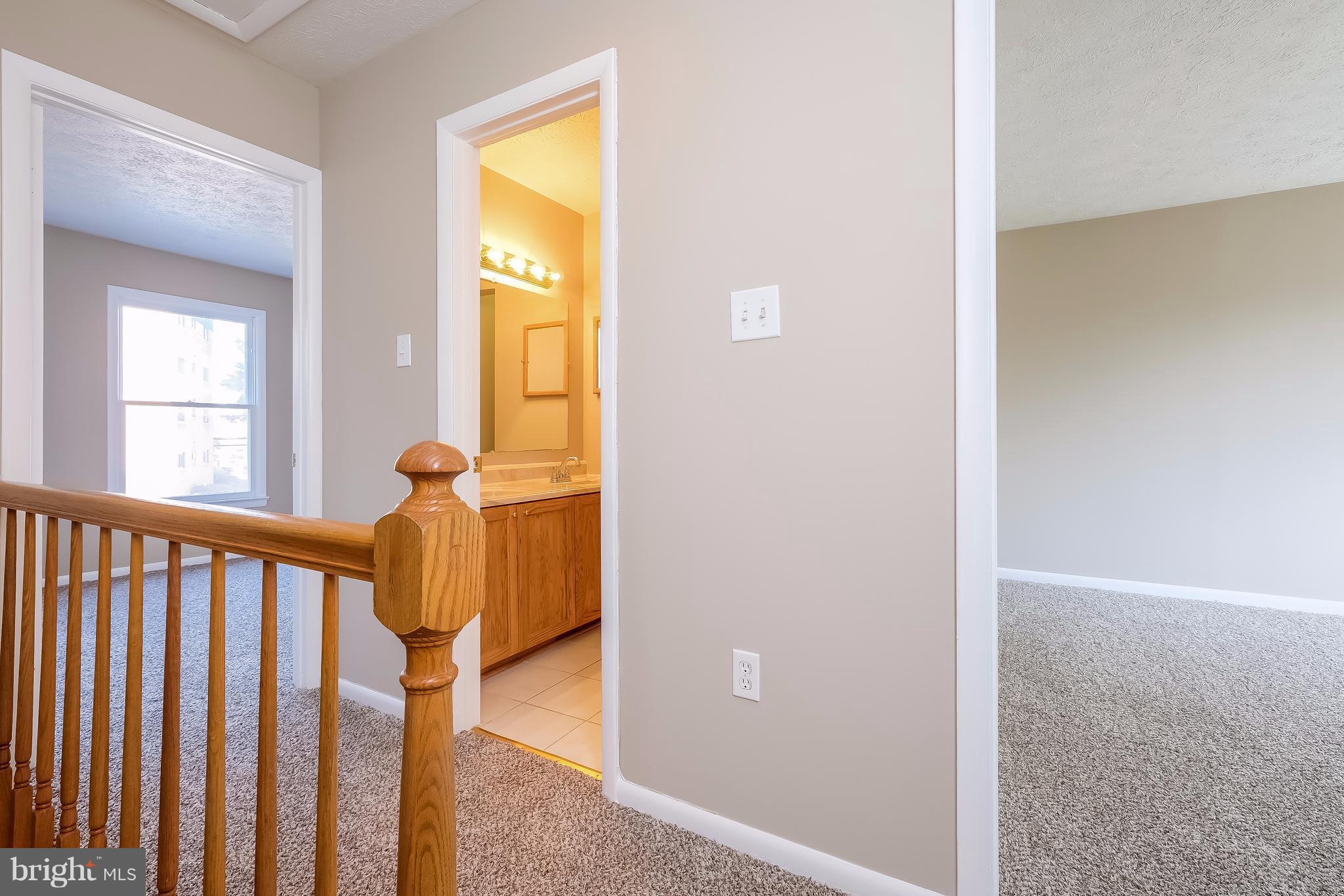 736 Ritchie Avenue Silver Spring, MD 20910 - Photo 12 of 29 a view of a hallway with wooden floor and staircase