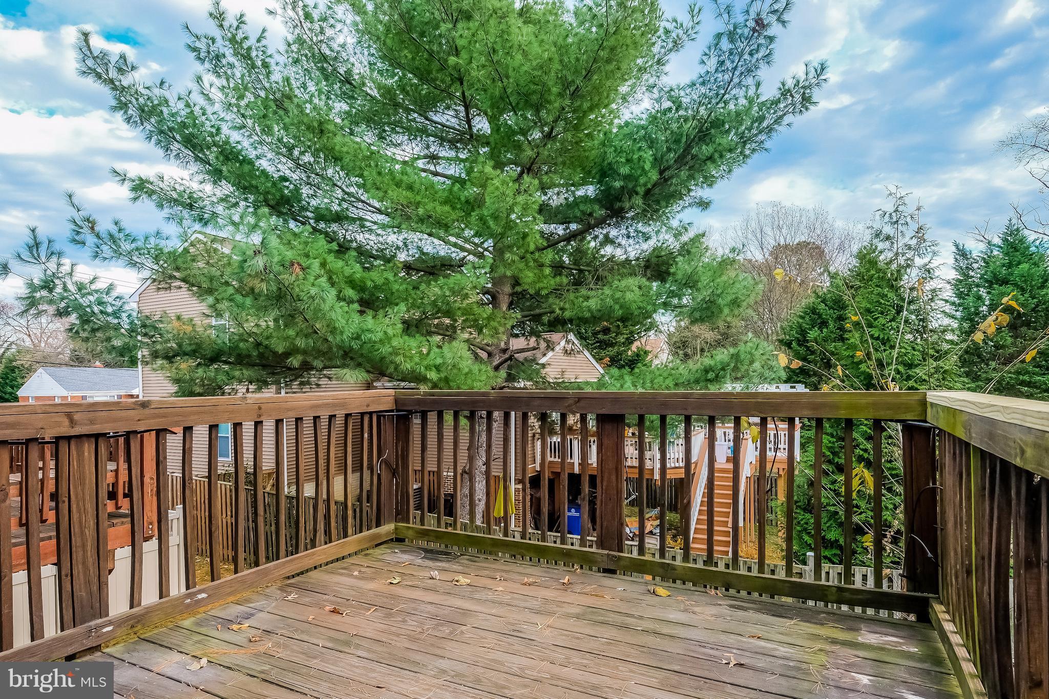 736 Ritchie Avenue Silver Spring, MD 20910 - Photo 23 of 29 a balcony with wooden floor and fence