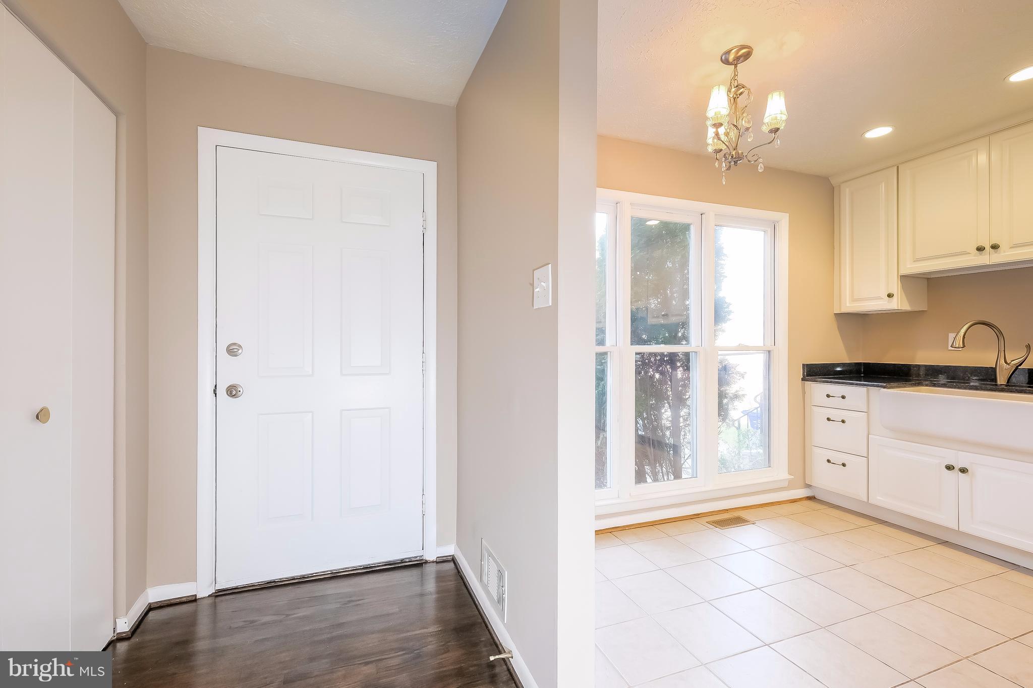 736 Ritchie Avenue Silver Spring, MD 20910 - Photo 4 of 29 a view of a kitchen with a sink and dishwasher with wooden floor