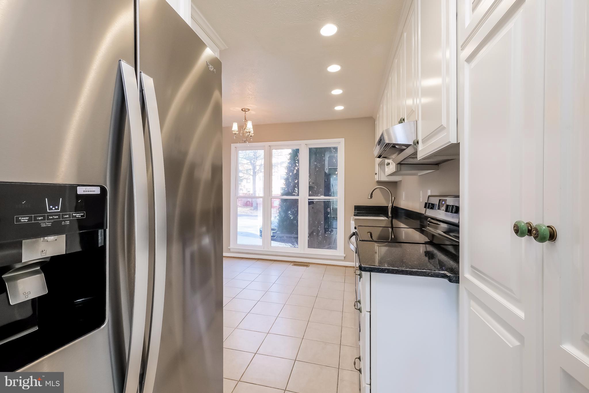 736 Ritchie Avenue Silver Spring, MD 20910 - Photo 8 of 29 a kitchen with stainless steel appliances a refrigerator and a sink