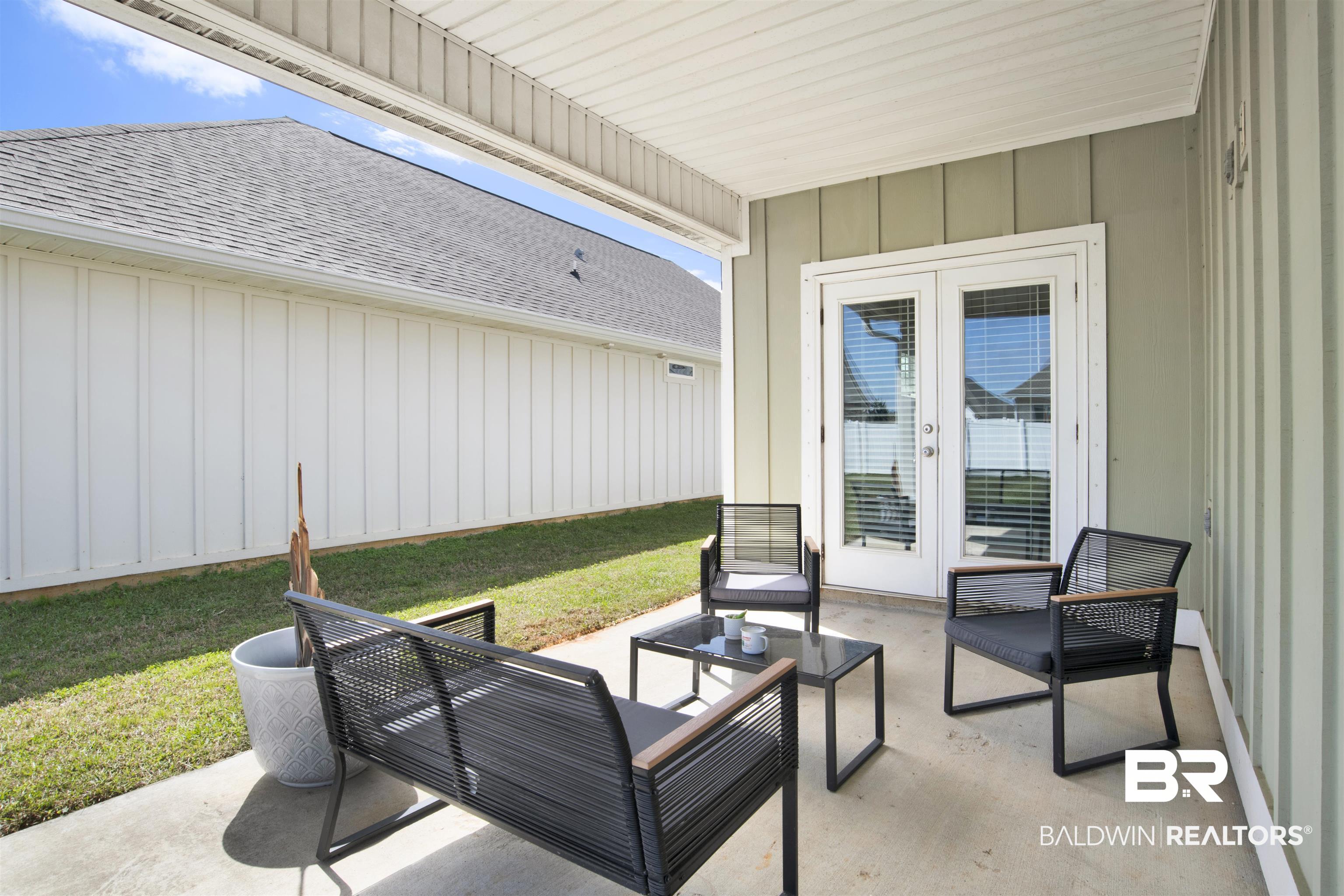 24253 Alydar Loop Daphne, AL 36526 - Photo 36 of 44 View of patio / terrace featuring french doors and outdoor furniture