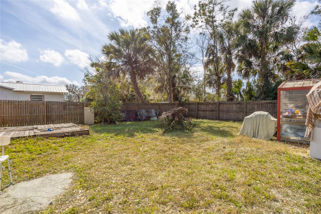 507 South Anderson Street Bunnell, FL 32110 - Photo 11 of 19 a view of a swimming pool with a patio and a yard