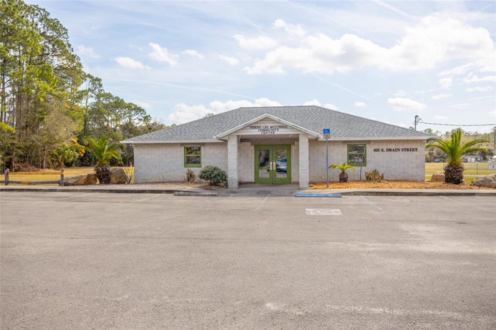 507 South Anderson Street Bunnell, FL 32110 - Photo 15 of 19 front view of a house with a yard and potted plants