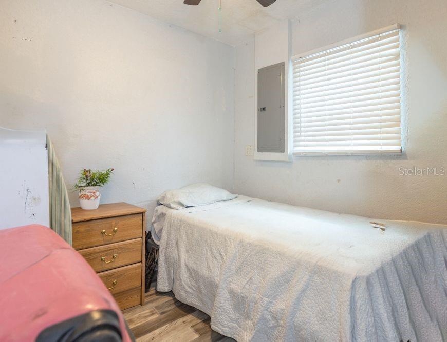 507 South Anderson Street Bunnell, FL 32110 - Photo 8 of 19 a bedroom with a bed and a window