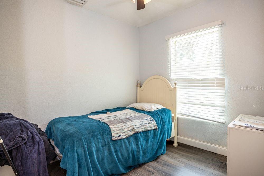 507 South Anderson Street Bunnell, FL 32110 - Photo 10 of 19 a bedroom with a bed and a window