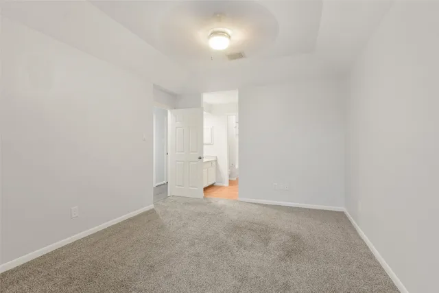 a view of an empty room and a window