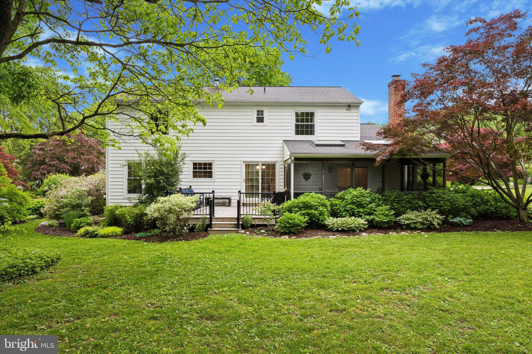 33 Ridge Road Malvern, PA 19355 - Photo 22 of 31 Screened Porch and deck overlook lush landscaping