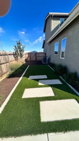 a bathroom with a sink vanity mirror and toilet