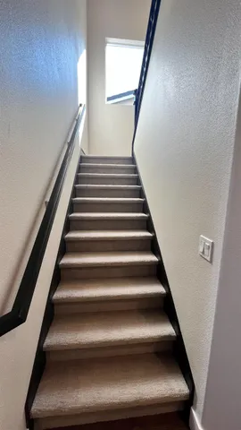 a kitchen with sink stove and cabinets