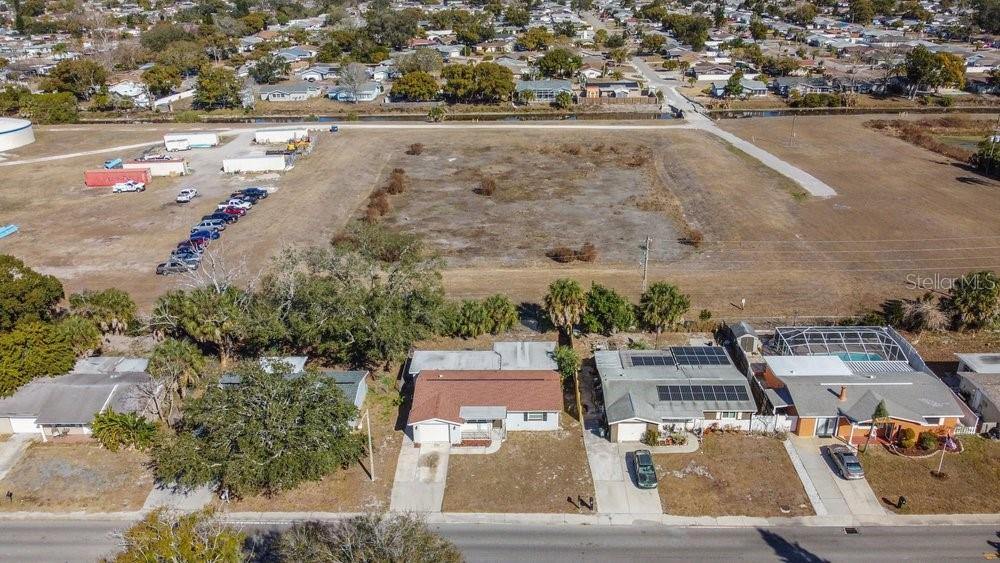 7605 Fox Hollow Drive Port Richey, FL 34668 - Photo 24 of 29 an aerial view of residential houses with outdoor space