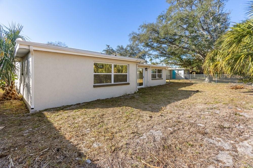 7605 Fox Hollow Drive Port Richey, FL 34668 - Photo 29 of 29 front view of a house with a yard