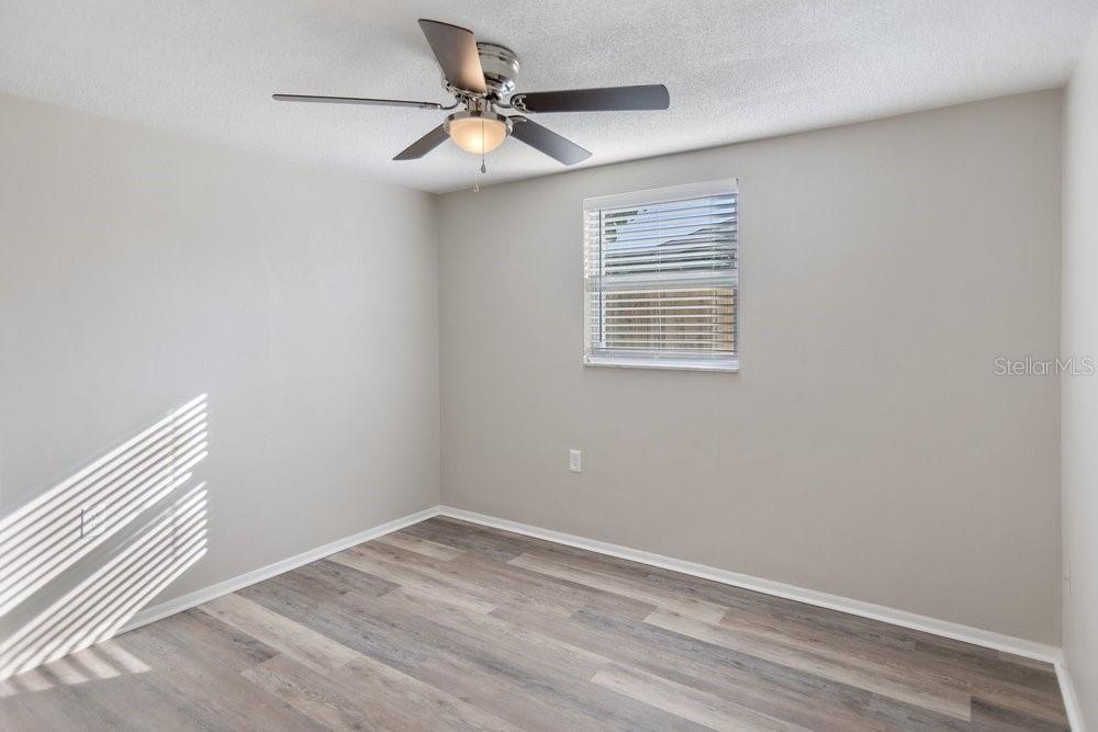 7605 Fox Hollow Drive Port Richey, FL 34668 - Photo 7 of 29 an empty room with a window