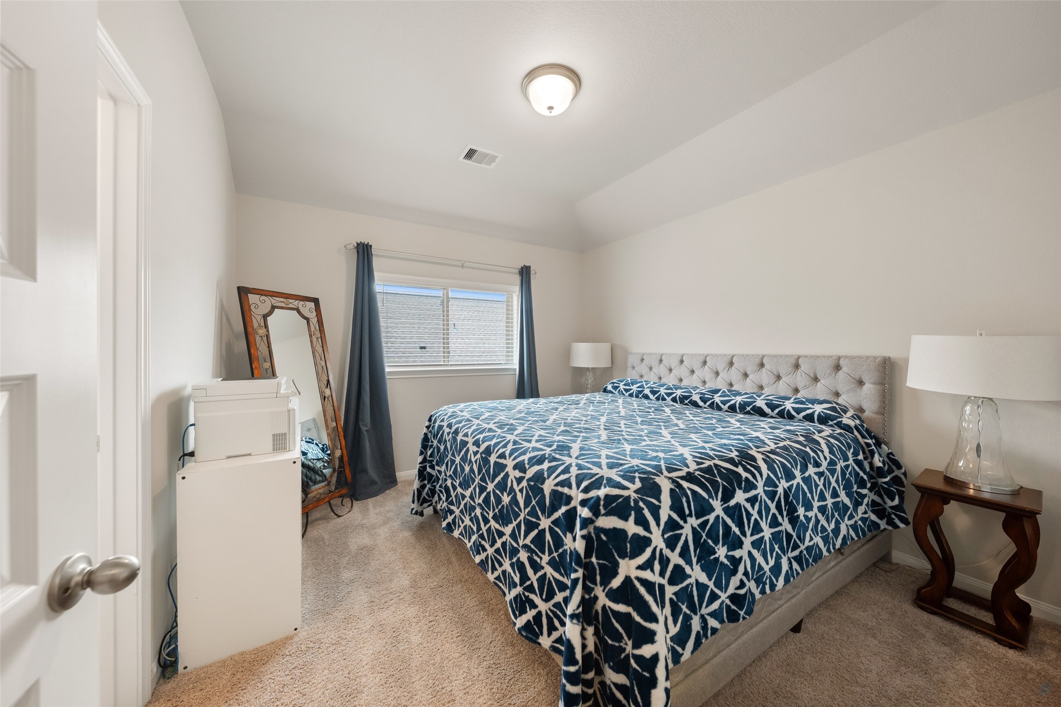 17323 Grand Canyon Road Conroe, TX 77302 - Photo 24 of 33 A second guest room with ensuite bath is a couple of steps up from the game room, defining a private spaace.