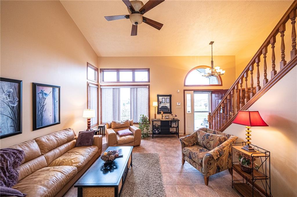 630 Hemlock Road Coraopolis, PA 15108 - Photo 11 of 25 High ceilings and large picture windows make this living room a bright and wonderfully relaxing spot to enjoy some downtime.