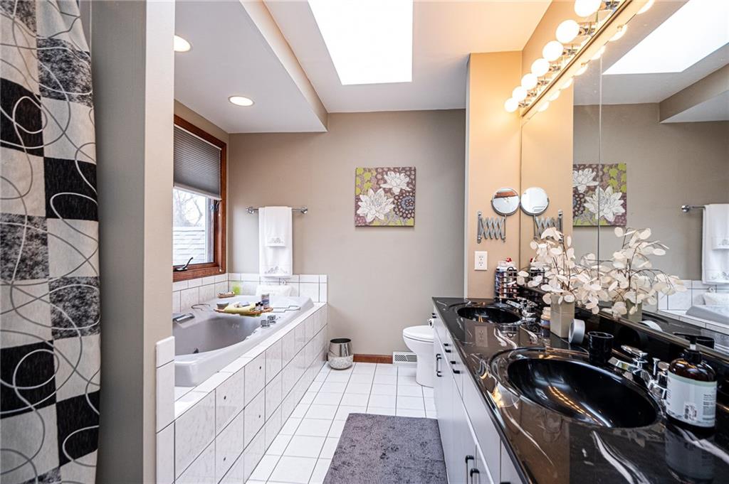 630 Hemlock Road Coraopolis, PA 15108 - Photo 15 of 25 Beautiful master bath with jetted tub, dual sinks, tile flooring, granite counters and separate shower.