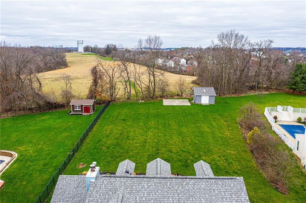 630 Hemlock Road Coraopolis, PA 15108 - Photo 23 of 25 Arial view of the backyard which shows the 16x16 shed with electric and a skylight as well as the large concrete pad, fire pit and basketball hoop.