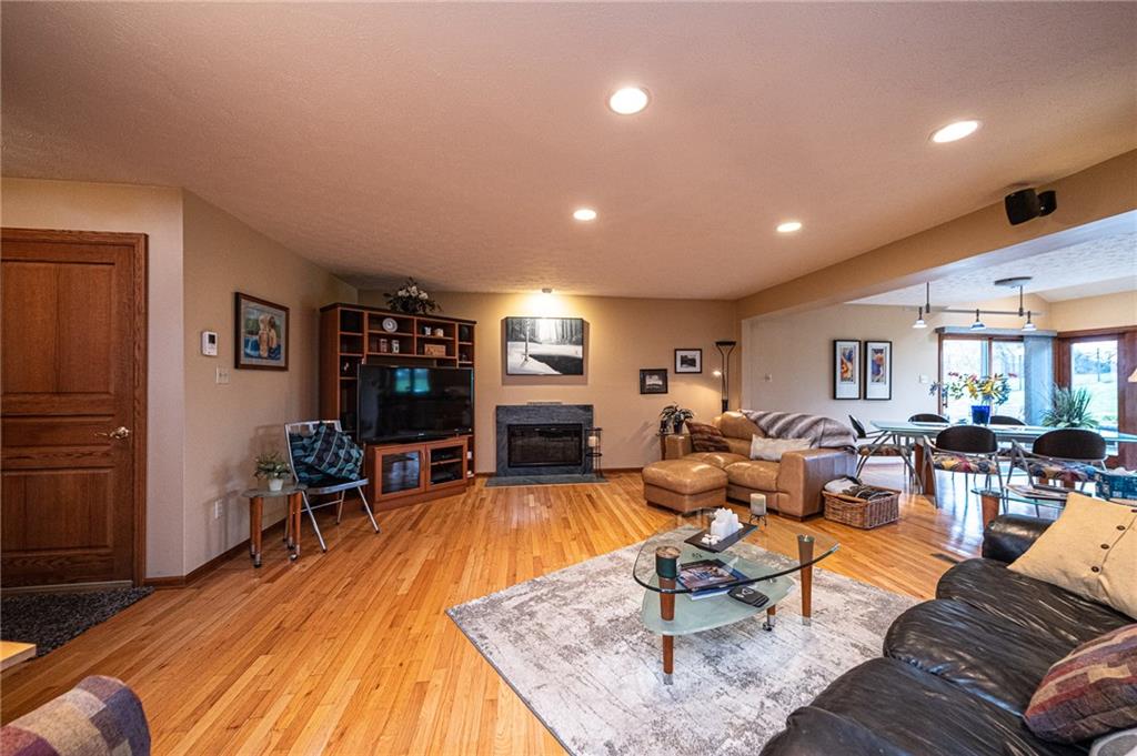 630 Hemlock Road Coraopolis, PA 15108 - Photo 8 of 25 The main floor large family room has beautiful hardwood flooring and fireplace and is open to the kitchen and dining area with views to the backyard.
