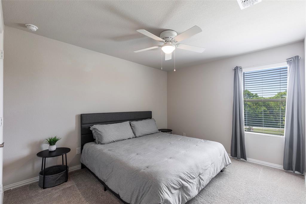 1504 Cobblestone Road Melissa, TX 75454 - Photo 24 of 40 2nd Comfortable and large secondary bedroom with soft natural light.