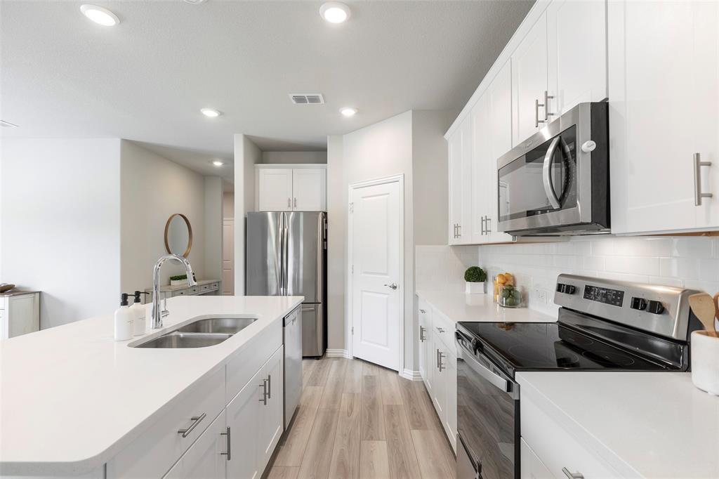 1504 Cobblestone Road Melissa, TX 75454 - Photo 7 of 40 Thoughtfully designed workspace with easy access to pantry.