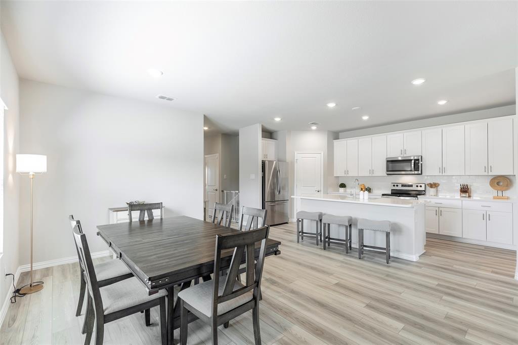 1504 Cobblestone Road Melissa, TX 75454 - Photo 10 of 40 Casual dining with soft natural light throughout the day open to the kitchen.