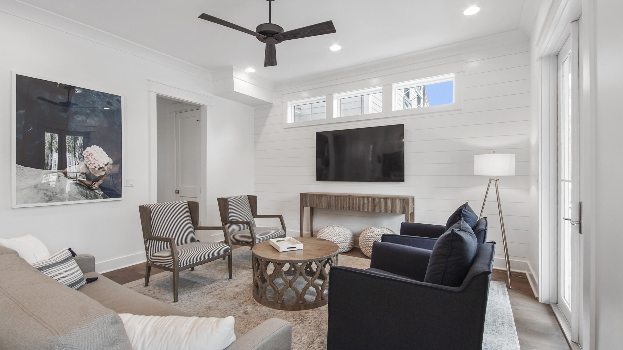 39 Beach Bike Way Inlet Beach Inlet Beach, FL 32461 - Photo 12 of 47 a living room with furniture a flat screen tv and a wall painting