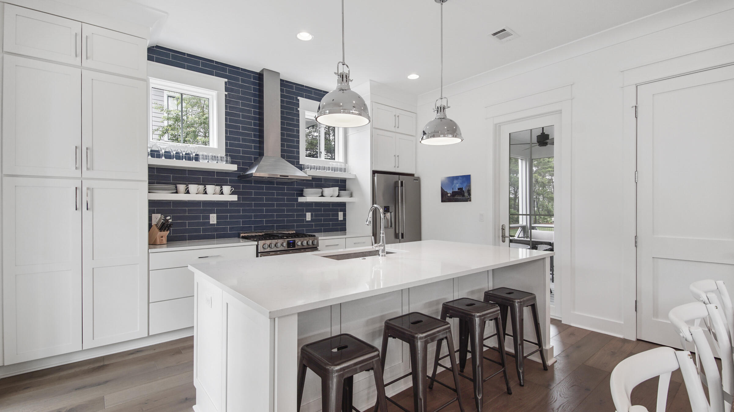39 Beach Bike Way Inlet Beach Inlet Beach, FL 32461 - Photo 5 of 47 a kitchen with stainless steel appliances a table and chairs in it