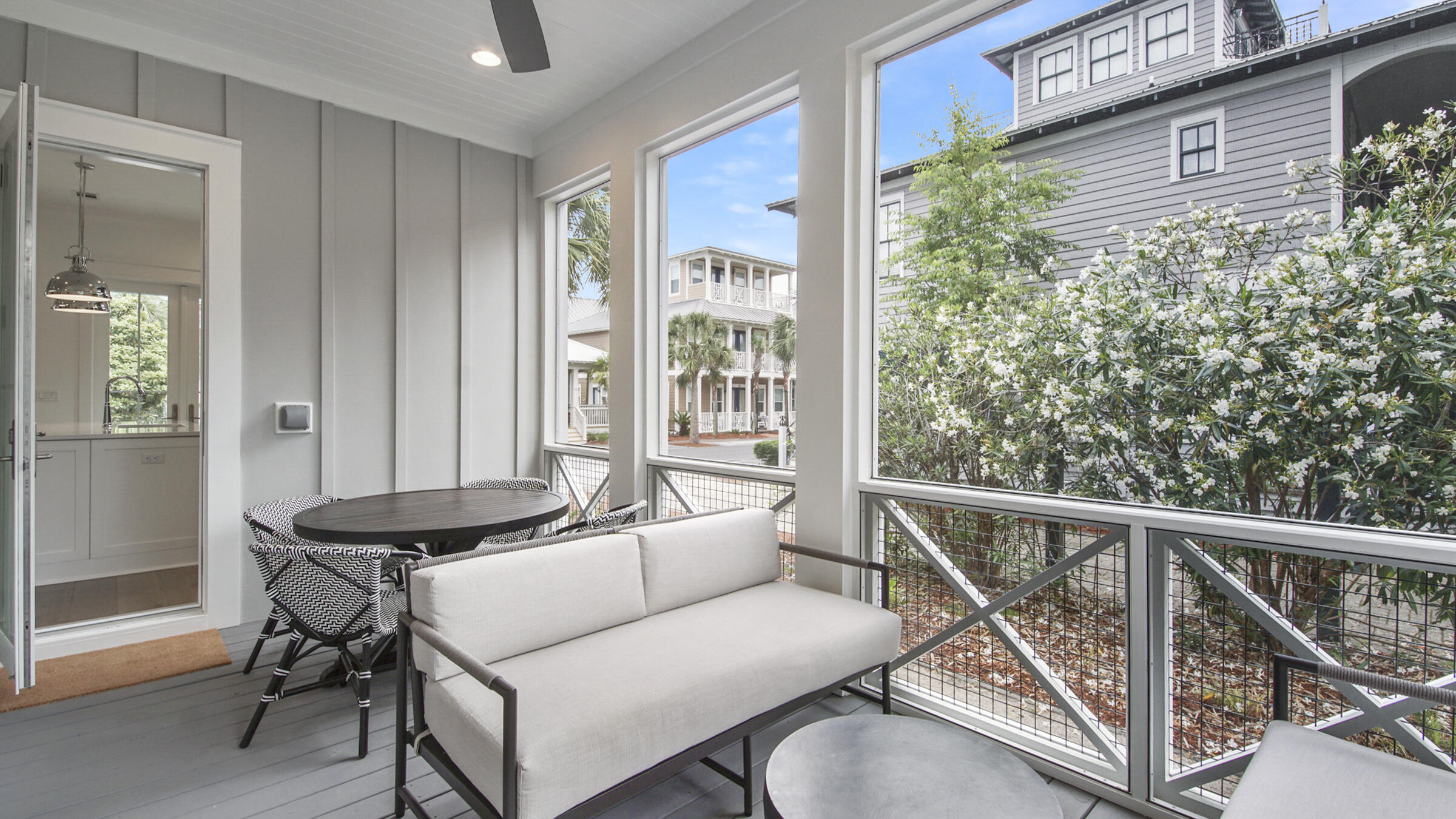 39 Beach Bike Way Inlet Beach Inlet Beach, FL 32461 - Photo 9 of 47 a balcony with furniture and a potted plant