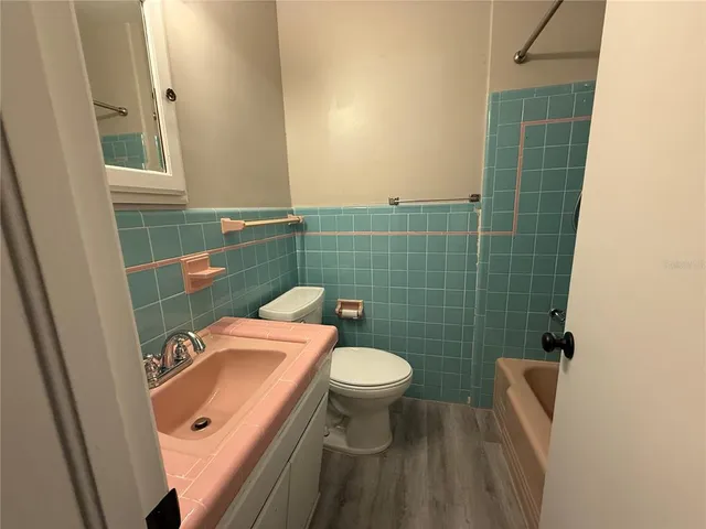 a bathroom with a bath tub
